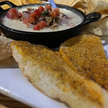 Uptown Kitchen + Taphouse - Queso with crostini - Gastropubs Near Me - Rogers, Arkansas