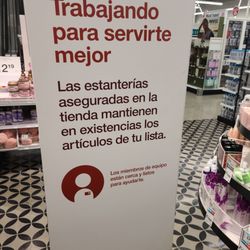 Sign in Spanish laughably claiming Target is working to serve you better. This location couldn't possibly serve people any worse.