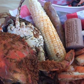 Phillips Seafood - Crabs, shrimp, and sausage on the Crab Deck. Life is good. - Seafood Near Me - Baltimore, Maryland Phillips Seafood - Crabs, shrimp, and sausage on the Crab Deck. Life is good. - Seafood Near Me - Baltimore, Maryland