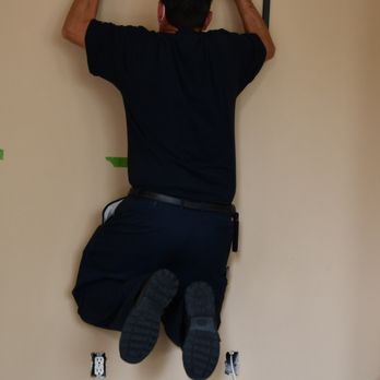 Lights On Electric - I could not believe this ....  Jason actually hung himself on the TV mount to make sure it was SOLID enough to hold the TV to the wall. - Electricians Near Me - Corona, California