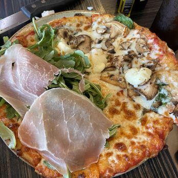 Luna Pizzeria - Half prosciutto and arugula, half mushroom personal pizza - Pizza Near Me - Houston, Texas Luna Pizzeria - Half prosciutto and arugula, half mushroom personal pizza - Pizza Near Me - Houston, Texas