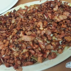 Cacique - Media orden de nachos de pastor.