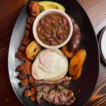 The Latin House - a plate of food on a table - Argentine Near Me - Walker, Michigan