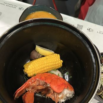 Chasin' Tails: Seafood that Celebrates! - Lobster tail with sauce served on the side. - Cajun/Creole Near Me - Falls Church, Virginia