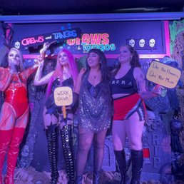 a group of women dressed in costumes a group of women dressed in costumes