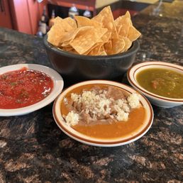 Housemade chips, salsa rojo & salsa verde, along with refried beans & coatija. Standard at their comfy bar! Housemade chips, salsa rojo & salsa verde, along with refried beans & coatija. Standard at their comfy bar!