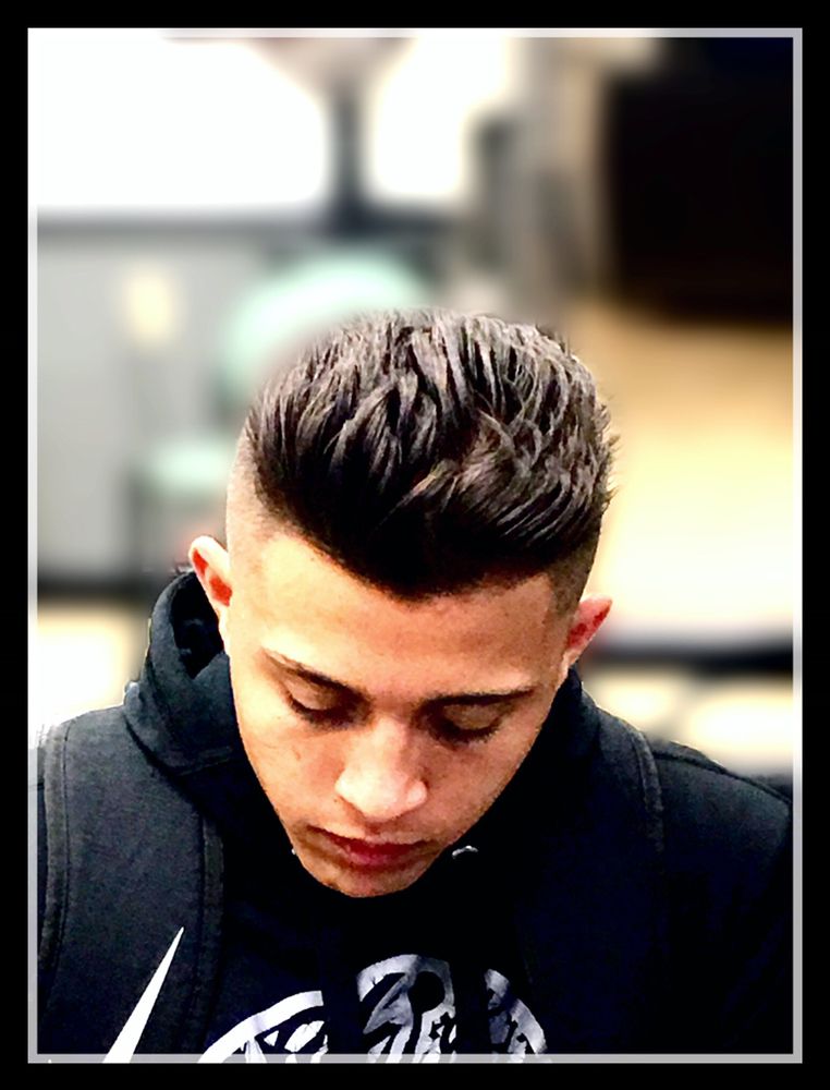 Trinidad the Barber at On the Edge Barber and Styling Logo