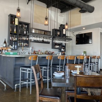 La Riv Kitchen & Bar - a bar with chairs - Italian Near Me - Temple, Texas