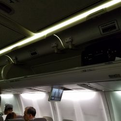 American Airlines - Empty overhead but they take your suitcase claiming there is no room.