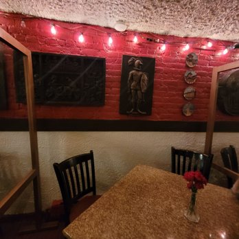 Cafe Riazor - Table and brick wall. - Spanish Near Me - New York, New York Cafe Riazor - Table and brick wall. - Spanish Near Me - New York, New York