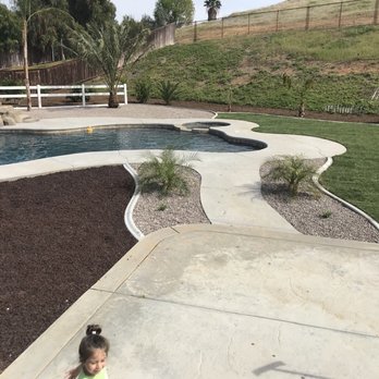 New Image Tree Care - Love the rocks the mulch in the cement divider's....trees everything is new - Tree Services Near Me - Corona, California