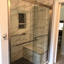 A view of the tiled shower with barn shower door. Spa-like!!!