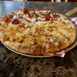 Brickhaus Brews - Pizza with half meat lover's and half chicken bacon ranch.