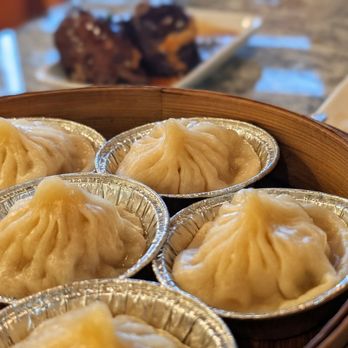 Coco Cuisine - Soup dumplings (foreground) w stuffed eggplant (background). - Cantonese Near Me - Columbus, Ohio Coco Cuisine - Soup dumplings (foreground) w stuffed eggplant (background). - Cantonese Near Me - Columbus, Ohio