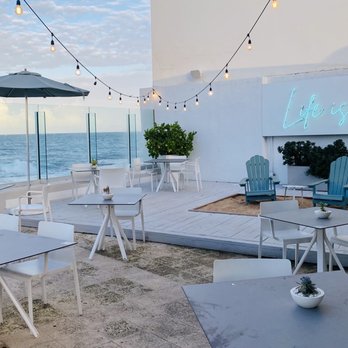 Sandbox Beach Bar - Table & chair seating behind bar - Cocktail Bars Near Me - San Juan, Puerto Rico Sandbox Beach Bar - Table & chair seating behind bar - Cocktail Bars Near Me - San Juan, Puerto Rico