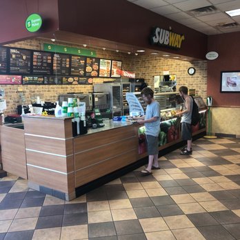 Subway - a woman standing at a counter in a subway - Sandwiches Near Me - Brenham, Texas