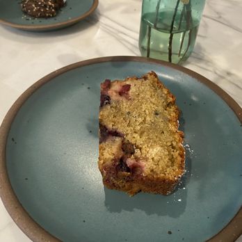 LMNOP Bakery - Polenta bread (chocolate tahini cookie in background) - Bakeries Near Me - Katonah, New York