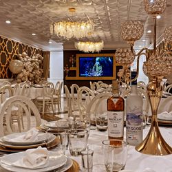 Central by X2O - our standard setup includes formal formal table setting and center piece candelabras.