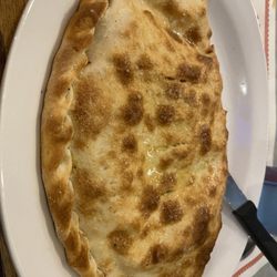 Halftime Restaurant Pizza & Cocktails - Pizza pocket with cheese and black olives