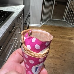 Baskin-Robbins - Ice cream inside of a paper wrapper from a cone holder and a cone outside. This was total BS!