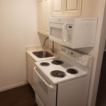 Madrigal Construction - a kitchen with white appliances - General Contractors Near Me