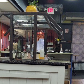 Aim 2 Please - a counter with a potted plant on top of it - Cafes Near Me - Hudson, New York Aim 2 Please - a counter with a potted plant on top of it - Cafes Near Me - Hudson, New York