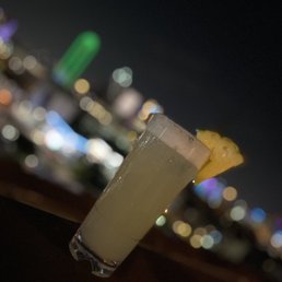 a cocktail with a pineapple garnish a cocktail with a pineapple garnish