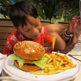 Simonette - An excited customer with his Cheeseburger and Fries.  The Fries were excellent (I did not try the Cheeseburger). - French Near Me - Culver City, California