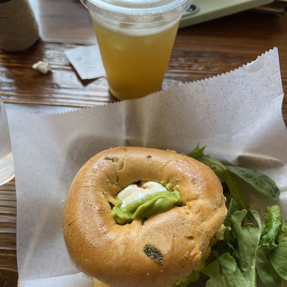 Loaded Bagel Breakfast Sandwich with jalapeño cheddar bagel and Jasmine lychee tea