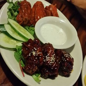 Restaurant 604 - Mixed chicken wings (mini thighs). Mildly spicy Teri and buffalo sauce. My favorite dish of the night - Breakfast & Brunch Near Me - Honolulu, Hawaii
