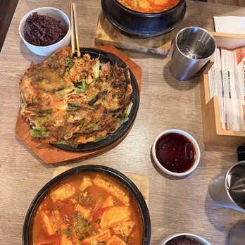 Jip Bap - Soon Tofu Jjigae - Bottom is beef, Top is seafood, Haemul Pajeon (Seafood pancake). Both with purple rice - Korean Near Me - Los Angeles, California Jip Bap - Soon Tofu Jjigae - Bottom is beef, Top is seafood, Haemul Pajeon (Seafood pancake). Both with purple rice - Korean Near Me - Los Angeles, California