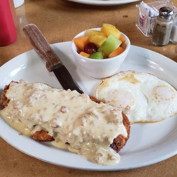 Gravy - Country fried steak with fruit and two over medium eggs. - American Near Me - Portland, Oregon