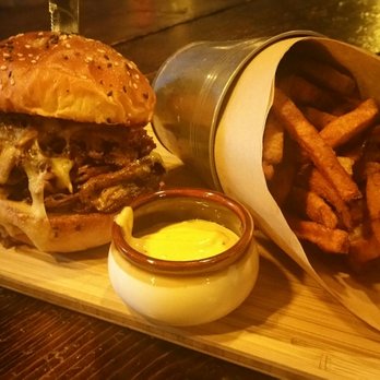Door FiftyFive - The Capone Brisket Sandwich served with a mix of sweet potato and regular potato fries with a side of Smoked Horseradish Alabama Sauce. - Southern Near Me - Mississauga, Ontario Door FiftyFive - The Capone Brisket Sandwich served with a mix of sweet potato and regular potato fries with a side of Smoked Horseradish Alabama Sauce. - Southern Near Me - Mississauga, Ontario