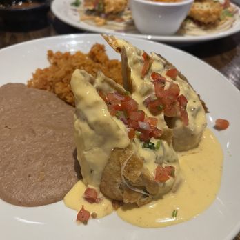 Mandi Cocina Mexicana - Fajita chimichanga with rice and beans - Mexican Near Me - Tomball, Texas Mandi Cocina Mexicana - Fajita chimichanga with rice and beans - Mexican Near Me - Tomball, Texas
