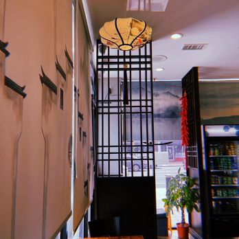 Magic Noodles - a view of a dining room with a clock on the wall - Noodles Near Me - Philadelphia, Pennsylvania