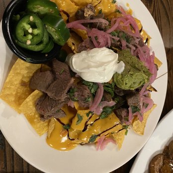 Local Goat - Steak Nachos* - New American Near Me - Pigeon Forge, Tennessee