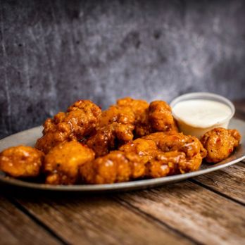 Toss Em Wing Factory - a plate of fried chicken wings - Chicken Shop Near Me - Pearl River, New York Toss Em Wing Factory - a plate of fried chicken wings - Chicken Shop Near Me - Pearl River, New York