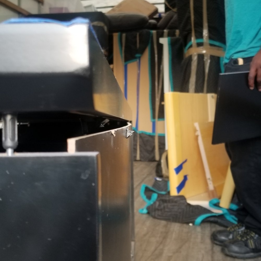 Clutter - Back of Entertainment Center - Self Storage Near Me