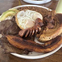 Bandeja Paisa and Pollo Saltado ( in the background)