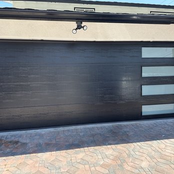 Omar's Garage Doors - 16'X7' Flush panel, steel back insulated with window on one side. - Garage Door Services Near Me Omar's Garage Doors - 16'X7' Flush panel, steel back insulated with window on one side. - Garage Door Services Near Me