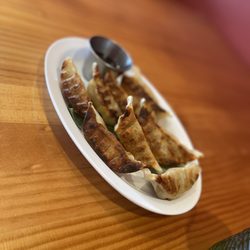 Taste of Korea - Pam fried dumplings(Gyoza) chicken and vegetable inside. Came with a Ponzu type dipping sauce.