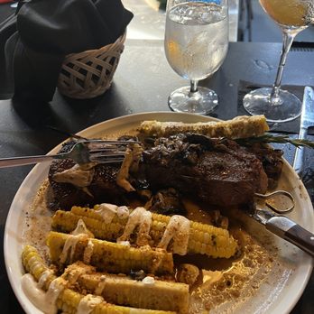 Corner Provisions - a plate of food and a glass of water - Seafood Near Me - Akron, Ohio
