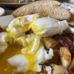Poached eggs over homemade hash.