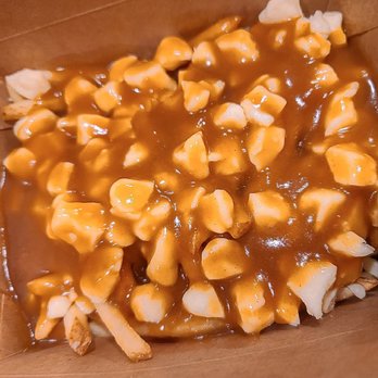 L’Hamburger - a box of fries covered in caramel sauce - Burgers Near Me - Montreal, Quebec L’Hamburger - a box of fries covered in caramel sauce - Burgers Near Me - Montreal, Quebec