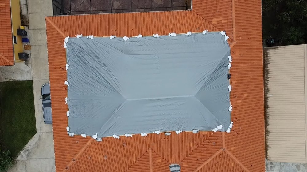 Slide of RoofTop Tarping
