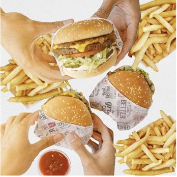 Habit Burger & Grill - ands holding burgers and french fries - Salad Near Me - San Jacinto, California Habit Burger & Grill - ands holding burgers and french fries - Salad Near Me - San Jacinto, California
