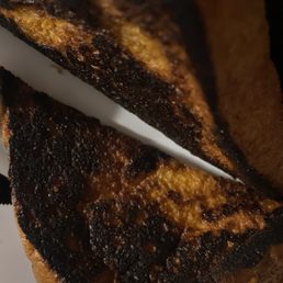 Burned French Toast. I'm not sure how chef's can't do this. Two different locations, third time trying still burned. Burned French Toast. I'm not sure how chef's can't do this. Two different locations, third time trying still burned.
