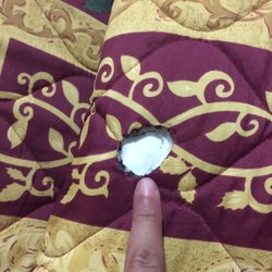 Rivers Inn - Cigaret burned comforter in the non-smoking rooms