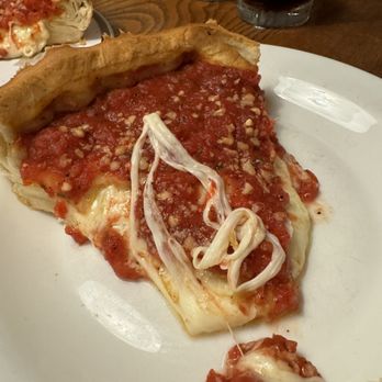 Giordano's - Slice of deep dish cheese pizza with garlic - Pizza Near Me - Chicago, Illinois Giordano's - Slice of deep dish cheese pizza with garlic - Pizza Near Me - Chicago, Illinois