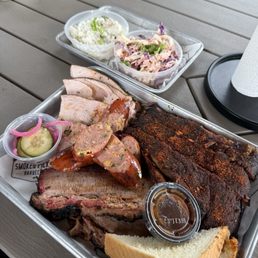 Turkey, brisket, smoked sausage, pork ribs, slaw, potato salad Turkey, brisket, smoked sausage, pork ribs, slaw, potato salad